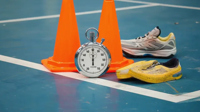 People-free sports-medicine still life with anatomical models, imaging and rehabilitation equipment illustrating When Can I Return to Sport After an Injury? The Criteria Surgeons Use